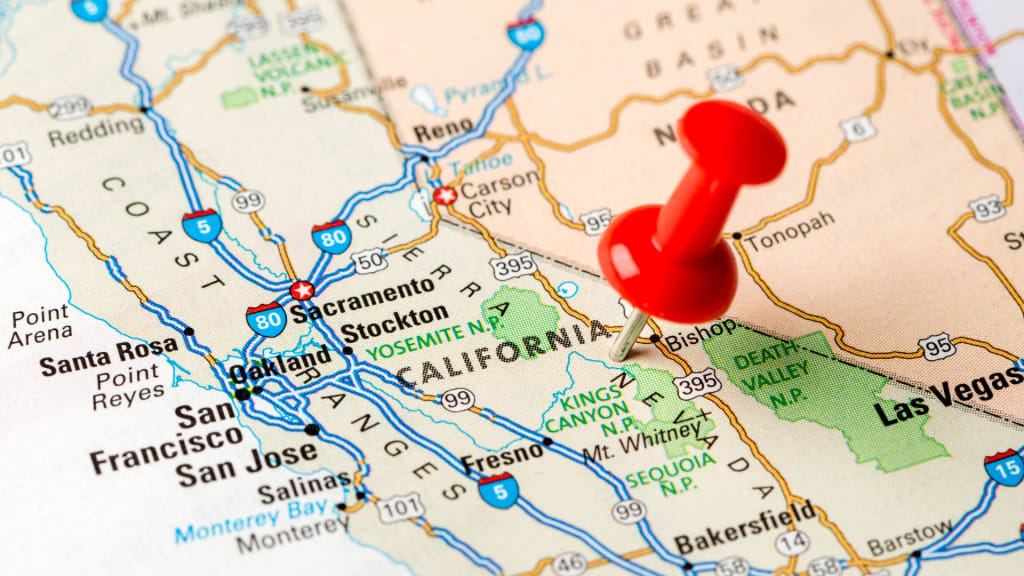 A map of California with a red pushpin marking an area near Death Valley, Kings Canyon, and Sequoia National Parks. Major cities like Los Angeles, San Francisco, and Las Vegas are also visible.